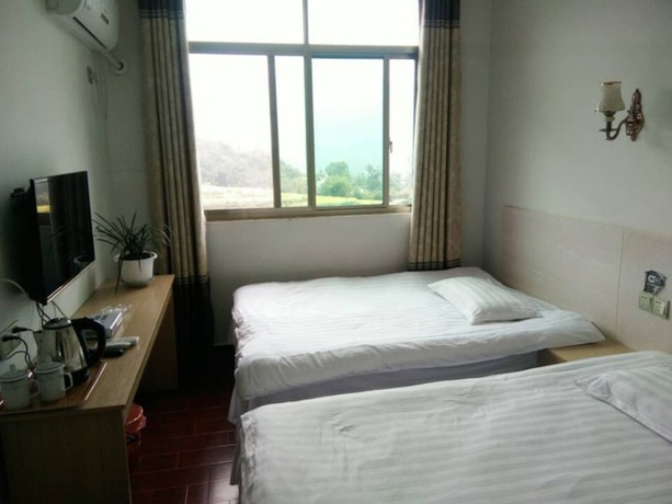Imagen general del Hotel Wuyuan Jiangling View Inn. Foto 2