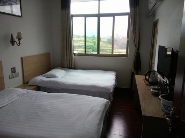 Imagen general del Hotel Wuyuan Jiangling View Inn. Foto 8