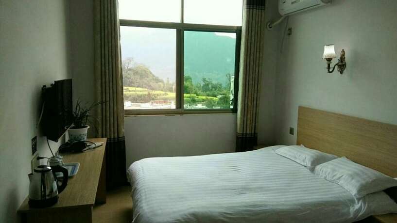 Imagen de la habitación del Hotel Wuyuan Jiangling View Inn. Foto 19