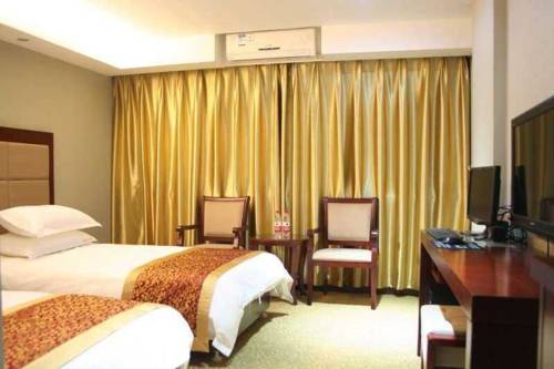 Imagen de la habitación del Hotel Wuyuan Poyang Lake Grand Hotel. Foto 1