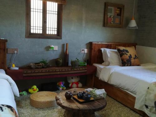 Imagen de la habitación del Hotel Wuyuan Qiye Yanxiang Guesthouse. Foto 8
