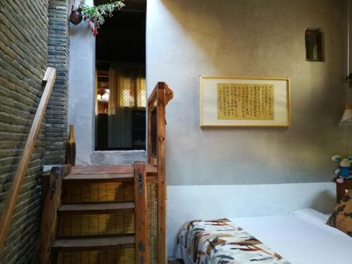 Imagen de la habitación del Hotel Wuyuan Qiye Yanxiang Guesthouse. Foto 10