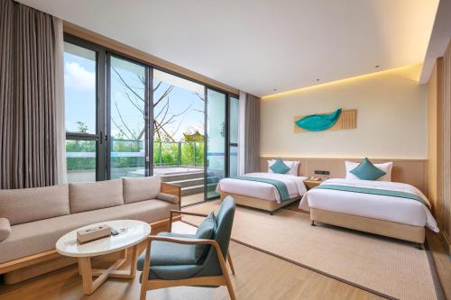 Imagen de la habitación del Hotel Wuyuan Wunvzhou chasheng hotel. Foto 16