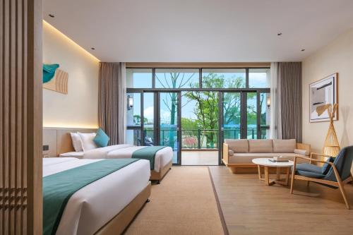 Imagen de la habitación del Hotel Wuyuan Wunvzhou chasheng hotel. Foto 17