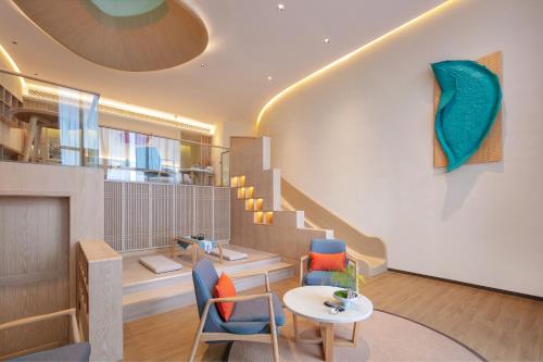 Imagen de la habitación del Hotel Wuyuan Wunvzhou chasheng hotel. Foto 18