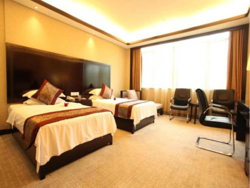 Imagen de la habitación del Hotel Wuyuan Xingjiang Bay Holiday. Foto 8