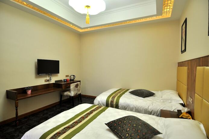 Imagen de la habitación del Hotel Wuzhen Chenhui Impression Theme Inn. Foto 16