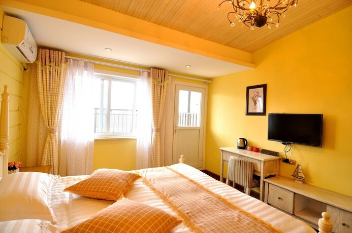 Imagen de la habitación del Hotel Wuzhen Chenhui Impression Theme Inn. Foto 17