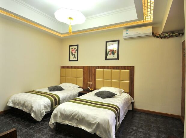 Imagen de la habitación del Hotel Wuzhen Chenhui Impression Theme Inn. Foto 18