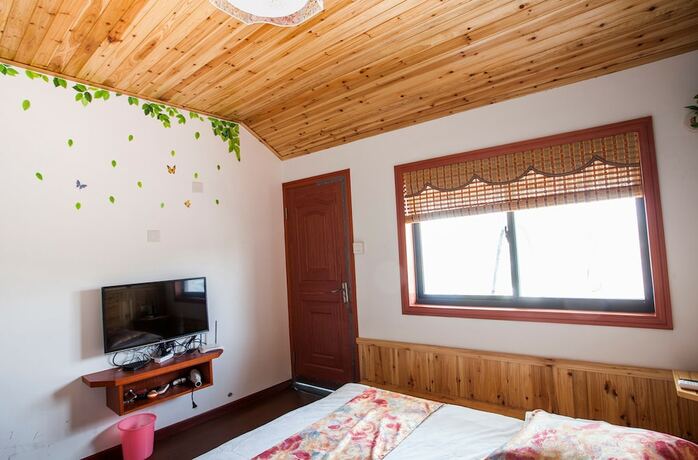 Imagen de la habitación del Hotel Wuzhen Helan Bridge Inn. Foto 17