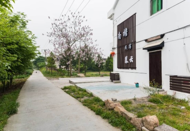 Imagen de los exteriores del Hotel Wuzhen Nanyan Muyun Homestay. Foto 11