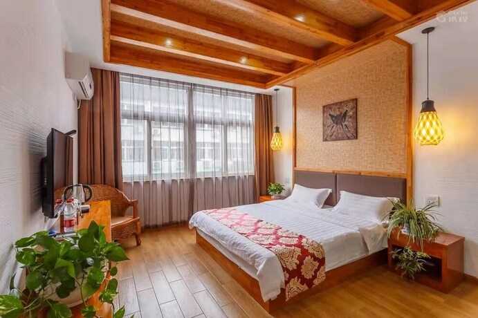 Imagen de la habitación del Hotel Wuzhen Tongyuan Shuixiang Guest House. Foto 27