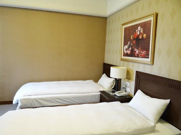 Imagen de la habitación del Hotel Wuzhou. Foto 17
