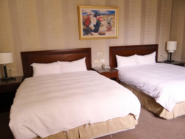 Imagen de la habitación del Hotel Wuzhou. Foto 18