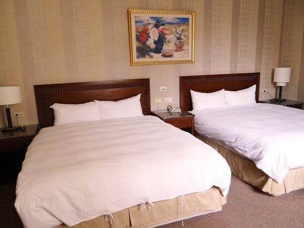 Imagen de la habitación del Hotel Wuzhou. Foto 20