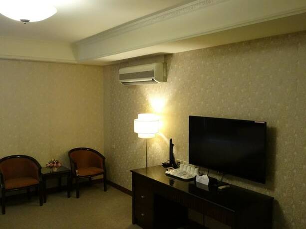 Imagen de la habitación del Hotel Wuzhou. Foto 21