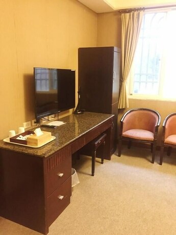 Imagen de la habitación del Hotel Wuzhou. Foto 24