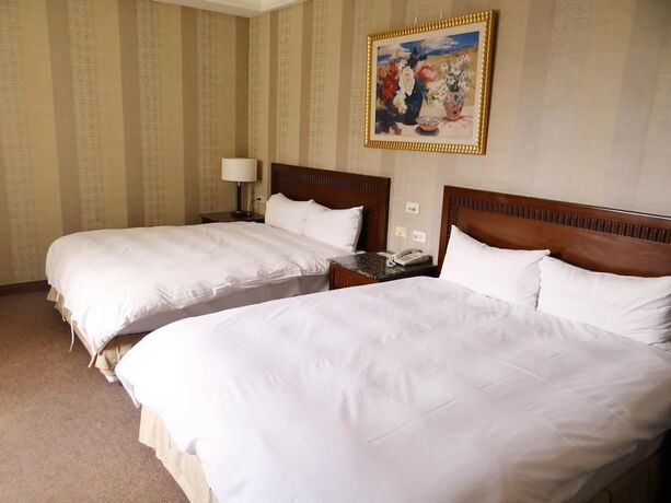 Imagen de la habitación del Hotel Wuzhou. Foto 25