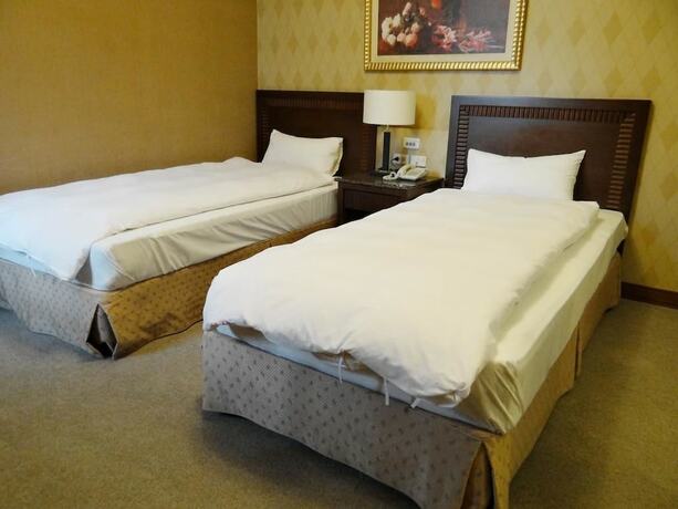 Imagen de la habitación del Hotel Wuzhou. Foto 26