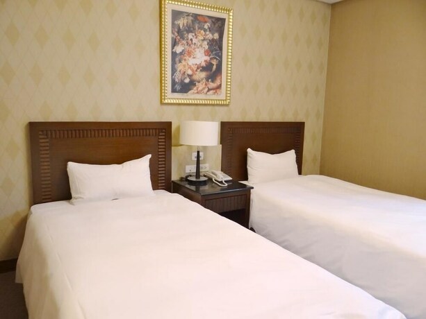 Imagen de la habitación del Hotel Wuzhou. Foto 27