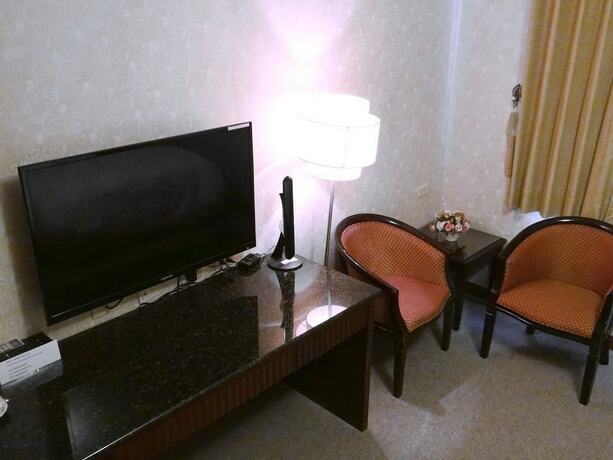 Imagen de la habitación del Hotel Wuzhou. Foto 28