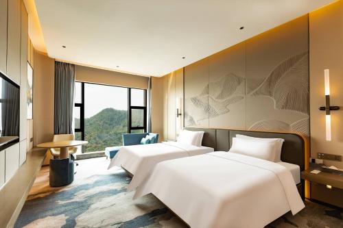 Imagen de la habitación del Hotel Wyndham Garden Gaozhou. Foto 12