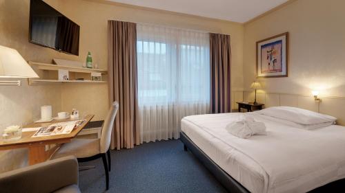 Imagen de la habitación del Hotel Wyndham Garden Gummersbach. Foto 11