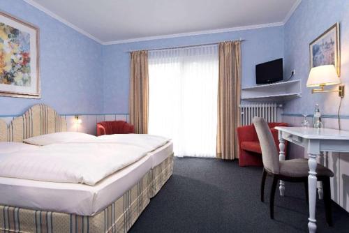 Imagen de la habitación del Hotel Wyndham Garden Gummersbach. Foto 19