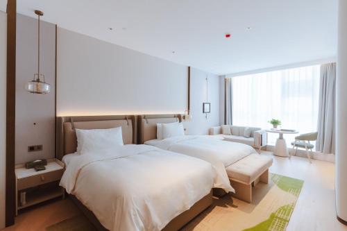 Imagen de la habitación del Hotel Wyndham Garden Huai\'an New City. Foto 20