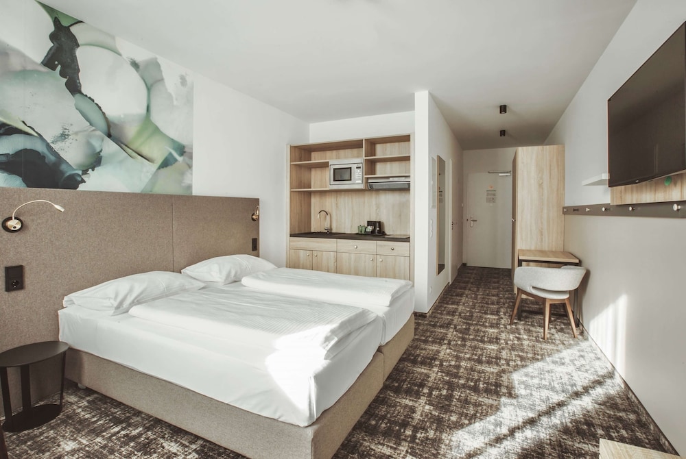 Imagen de la habitación del Hotel Wyndham Garden Munich Messe. Foto 4