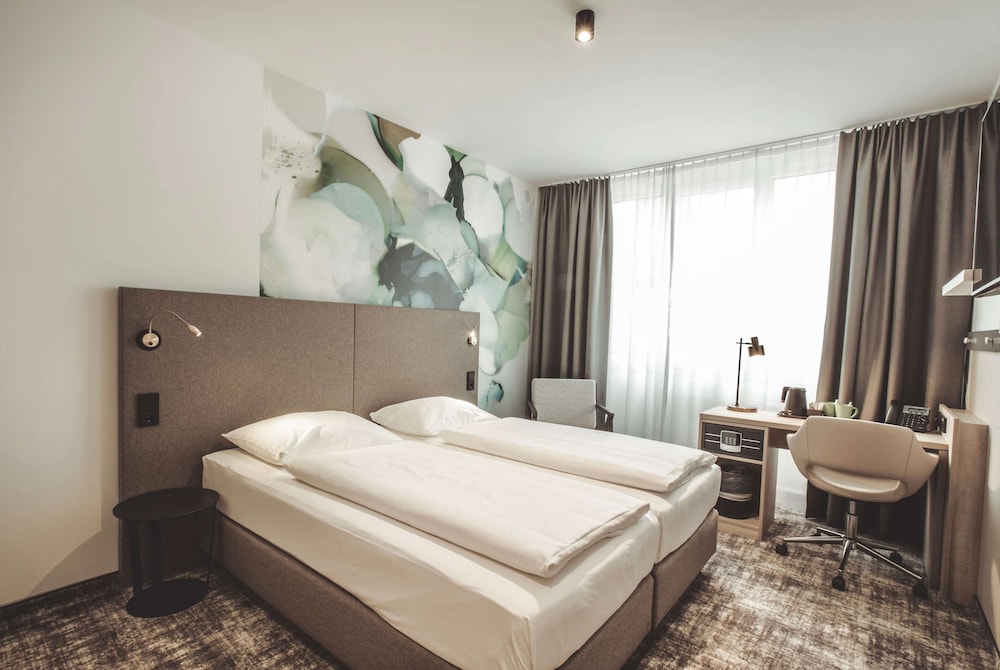 Imagen de la habitación del Hotel Wyndham Garden Munich Messe. Foto 7