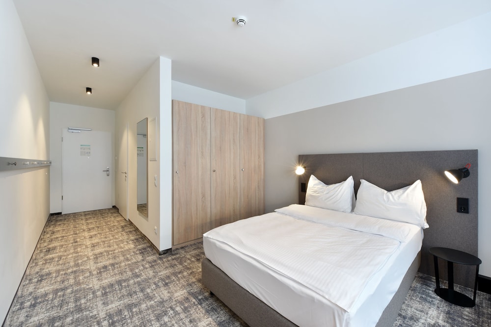 Imagen de la habitación del Hotel Wyndham Garden Munich Messe. Foto 9