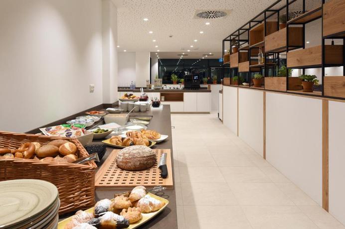 Imagen de los interiores del Hotel Wyndham Garden Munich Messe. Foto 14