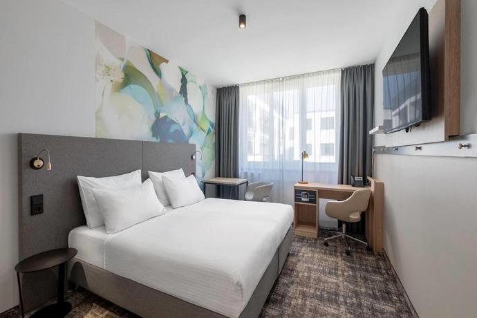 Imagen de la habitación del Hotel Wyndham Garden Munich Messe. Foto 8