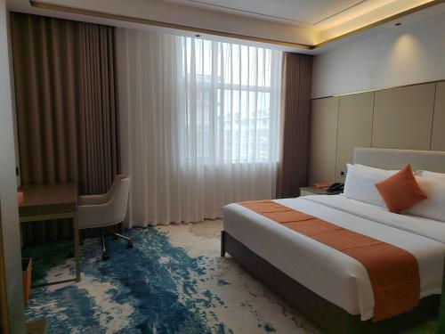 Imagen de la habitación del Hotel Wyndham Garden Rizhao Donggang Resort. Foto 12