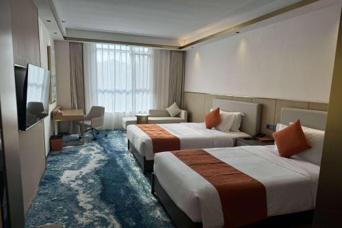 Imagen de la habitación del Hotel Wyndham Garden Rizhao Donggang Resort. Foto 14