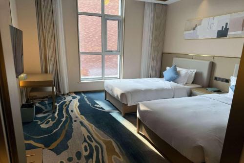 Imagen de la habitación del Hotel Wyndham Garden Rizhao Donggang Resort. Foto 19