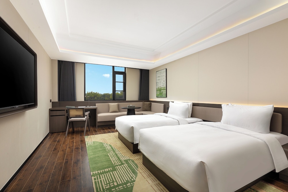 Imagen de la habitación del Hotel Wyndham Garden Shanghai Pudong. Foto 10