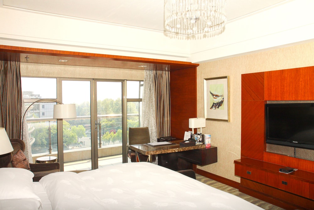 Imagen de la habitación del Hotel Wyndham Grand Plaza Royale Hangzhou. Foto 11