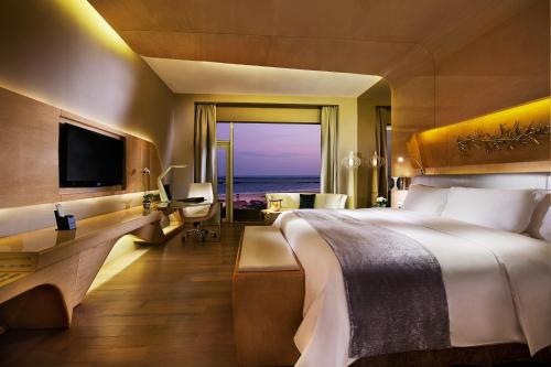 Imagen de la habitación del Hotel Wyndham Grand Qingdao. Foto 7