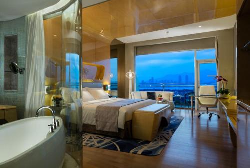 Imagen de la habitación del Hotel Wyndham Grand Qingdao. Foto 9