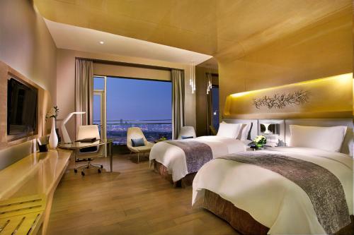 Imagen de la habitación del Hotel Wyndham Grand Qingdao. Foto 10
