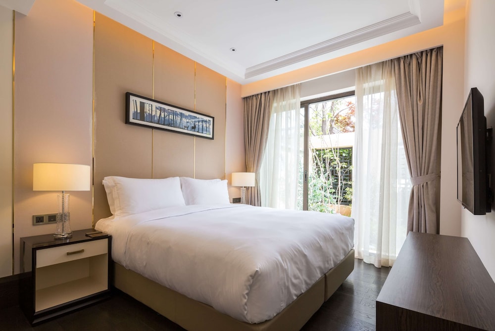 Imagen de la habitación del Hotel Wyndham Grand Royal Hotel Jinlin Lijiang. Foto 6