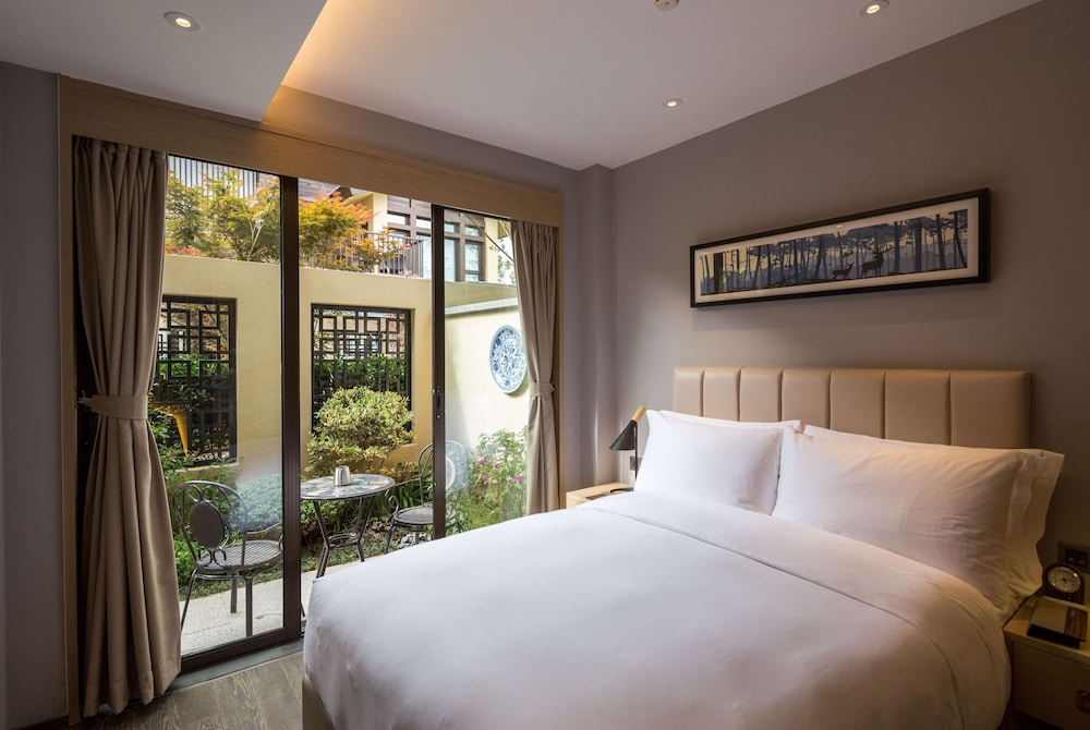 Imagen de la habitación del Hotel Wyndham Grand Royal Hotel Jinlin Lijiang. Foto 7
