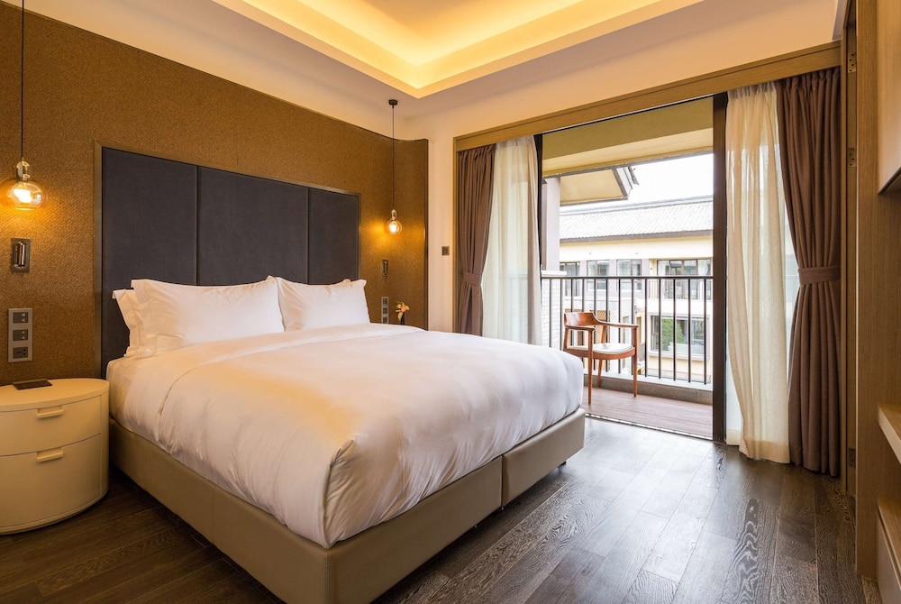 Imagen de la habitación del Hotel Wyndham Grand Royal Hotel Jinlin Lijiang. Foto 9