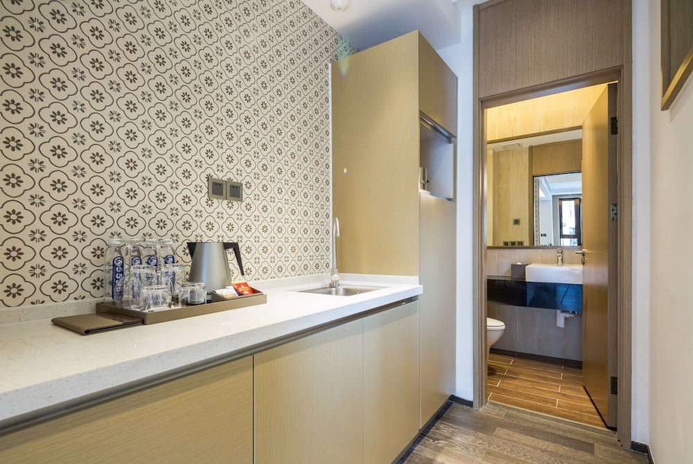 Imagen de la habitación del Hotel Wyndham Grand Royal Hotel Jinlin Lijiang. Foto 11