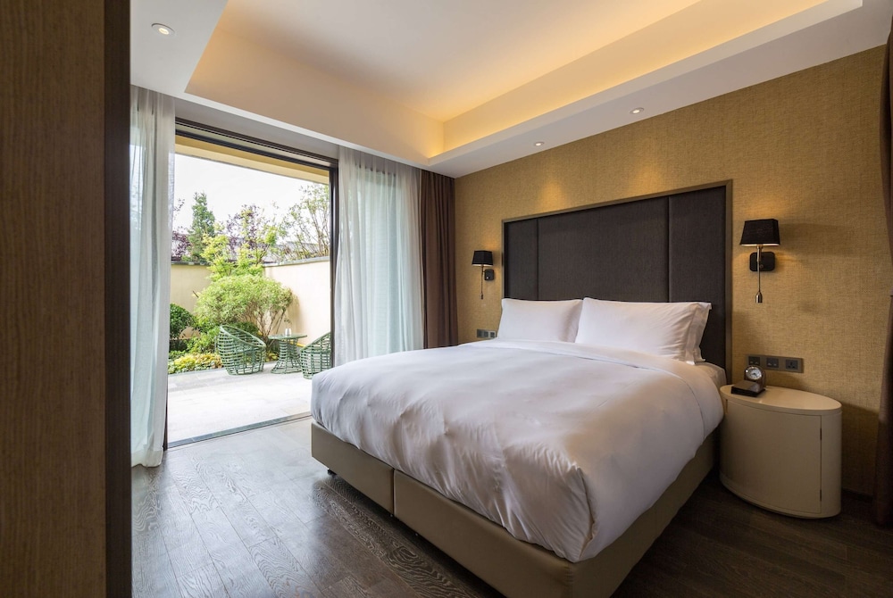 Imagen de la habitación del Hotel Wyndham Grand Royal Hotel Jinlin Lijiang. Foto 13