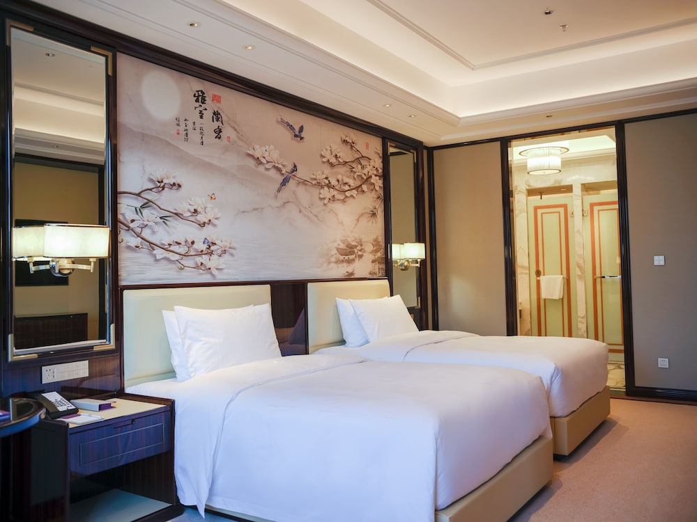 Imagen de la habitación del Hotel Wyndham Grand Tongren Downtown. Foto 10