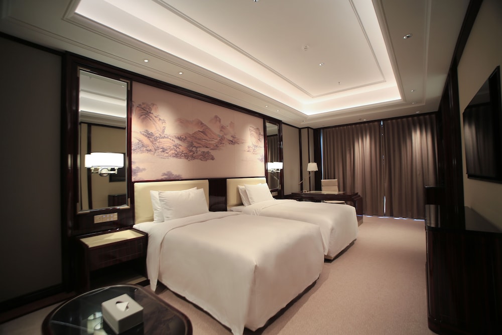 Imagen de la habitación del Hotel Wyndham Grand Tongren Downtown. Foto 16