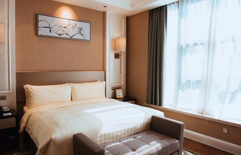 Imagen de la habitación del Hotel Wyndham Grand Xian Residence. Foto 11